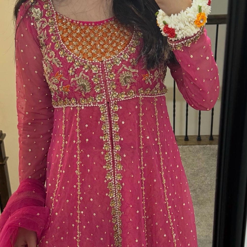 Vibrant Pink Lehenga with Gold Embellishments
